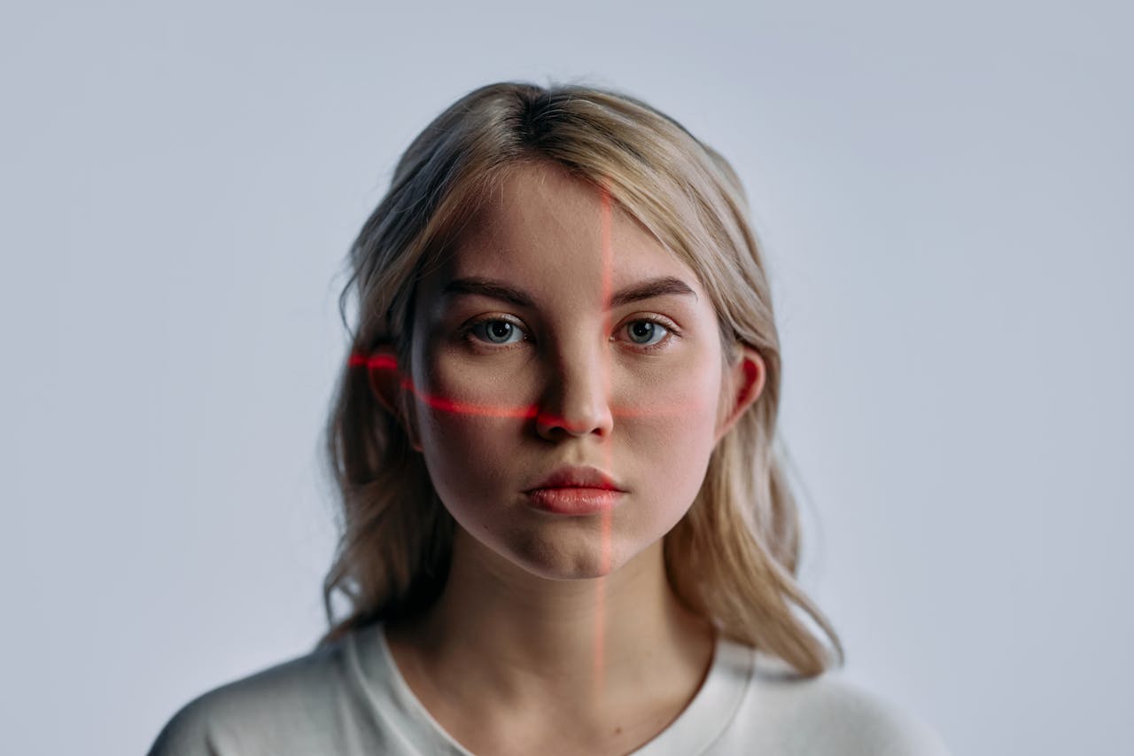 image of woman with laser light as a red cross