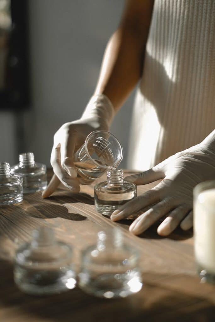 woman pouring aromatherapy oils