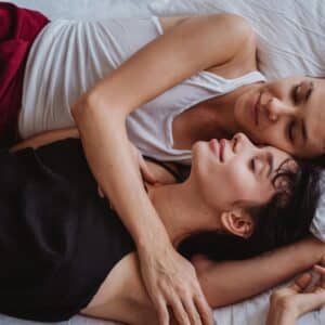 man and woman sleeping together in an embrace